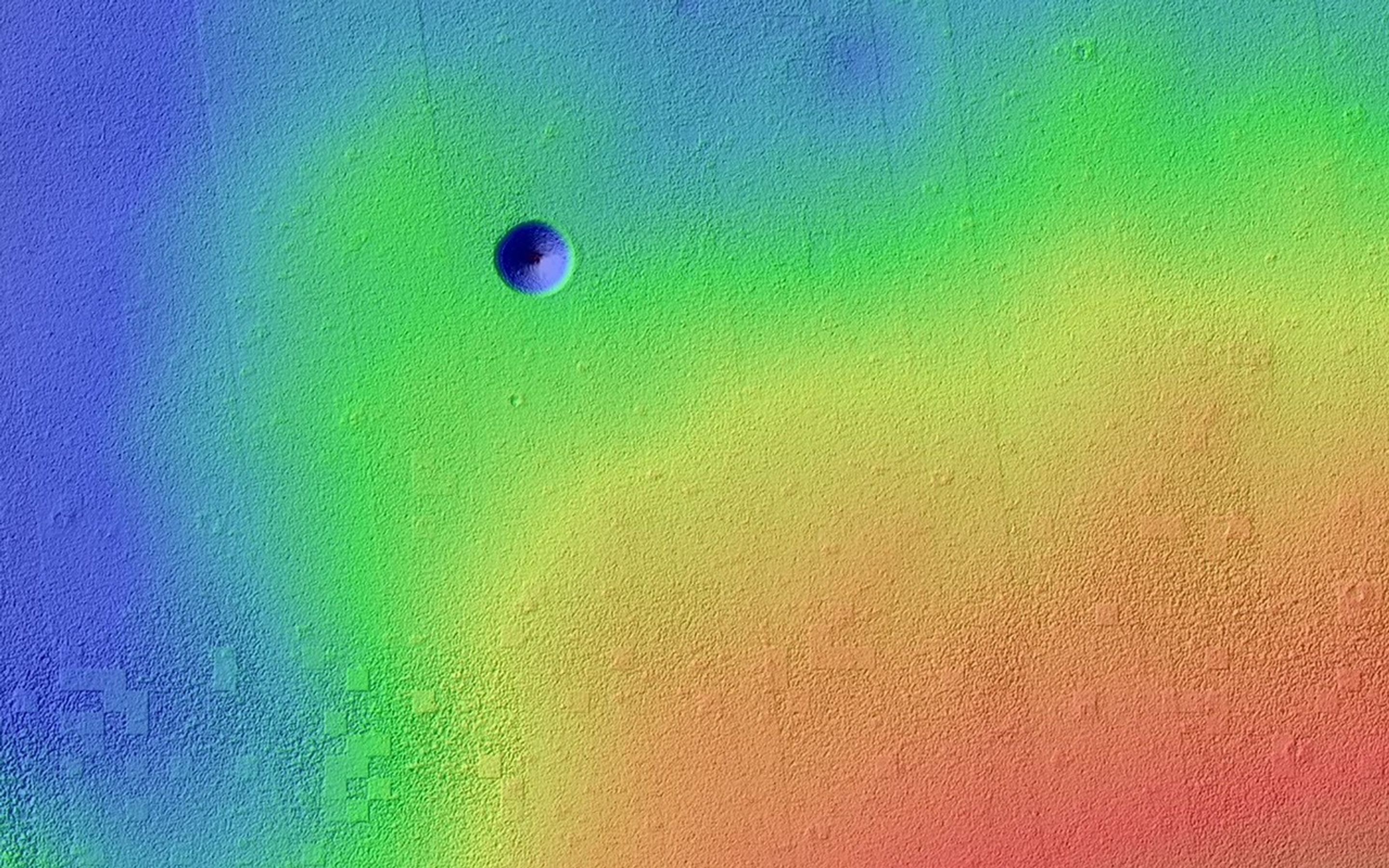 Pavonis Mons is a giant shield volcano similar to (although larger than) those on the Big Island of Hawaii. This image is from NASA's Mars Reconnaissance Orbiter.