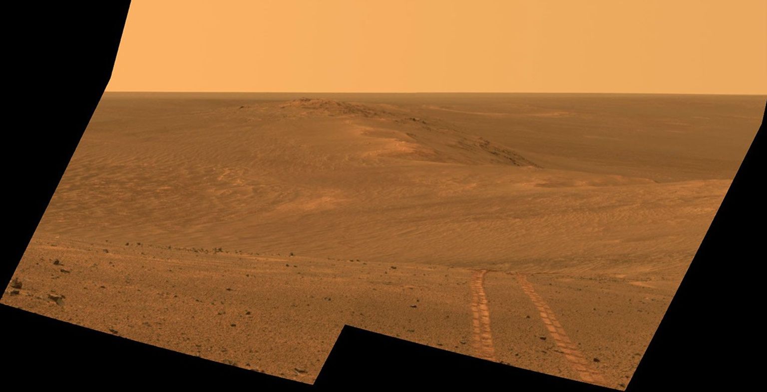 This scene from the Pancam on NASA's Mars Exploration Rover Opportunity looks back toward part of the west rim of Endeavour Crater that the rover drove along, heading southward, during the summer of 2014.