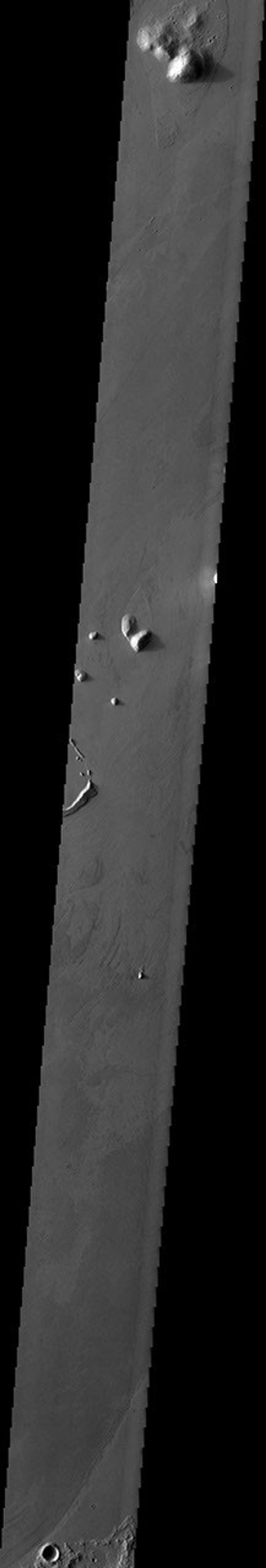 The streamlined islands in this image captured by NASA's 2001 Mars Odyssey spacecraft are part of Marte Vallis.