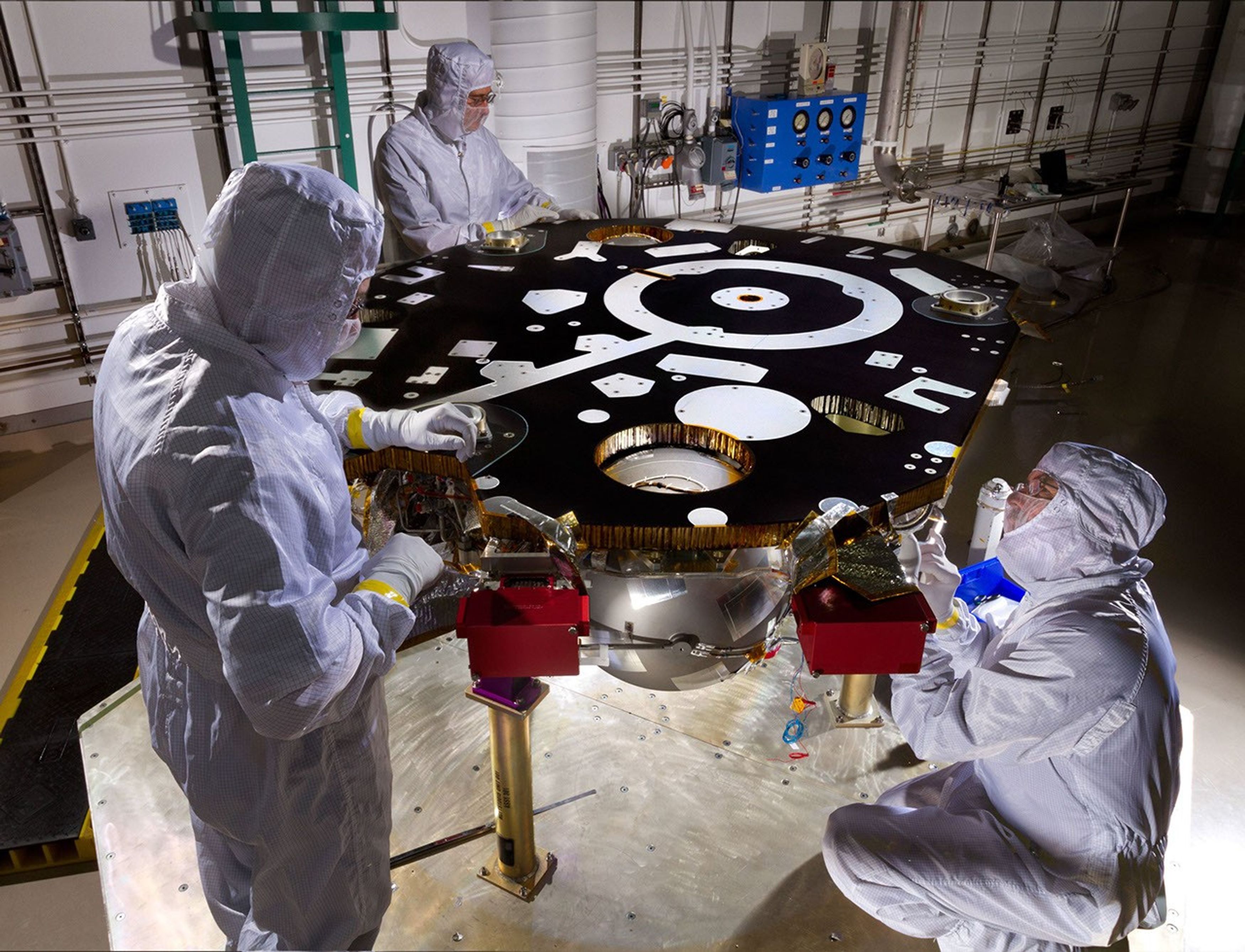 Technicians in a Lockheed Martin clean room near Denver prepare NASA's InSight Mars lander for propulsion proof and leak testing on Oct. 31, 2014. Following the test, the lander was moved to another clean room for start of the mission's ATLO phase.