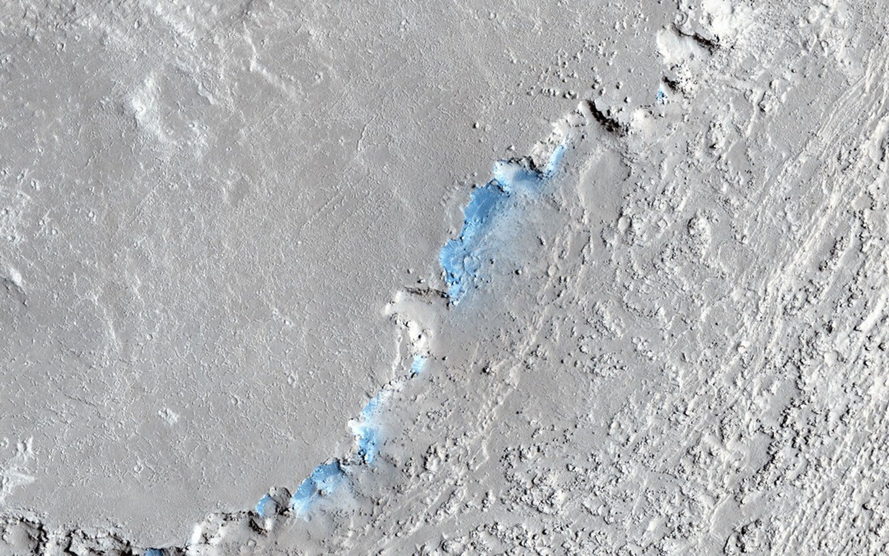 This image captured by NASA's Mars Reconnaissance Orbiter shows a small channel cutting into young volcanic lavas in a region where massive catastrophic flooding took place in the relatively recent past in the Athabasca Valles region.