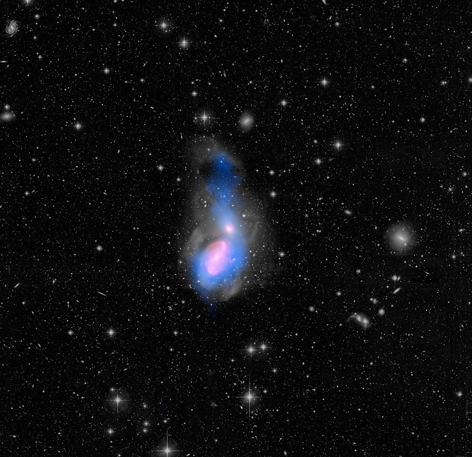 A new feature in the evolution of galaxies has been captured in this image of galactic interactions. The two galaxies seen here -- NGC 3226 at the top, NGC 3227 at the bottom.
