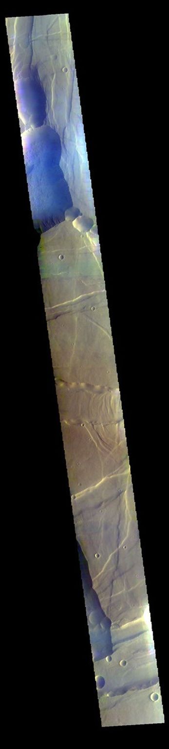 This false color image from NASA's 2001 Mars Odyssey spacecraft covers part of Noctis Labyrinthus. The bluish tone in the lower elevation depressions may indicate atmospheric haze.