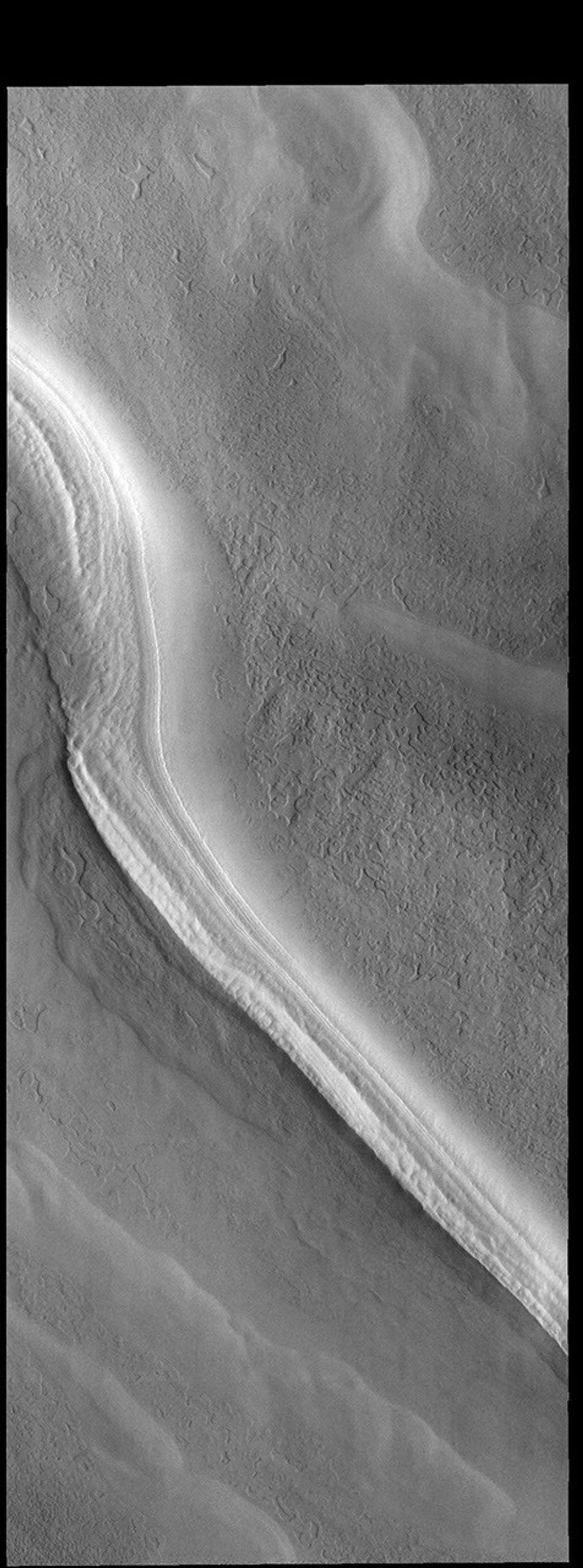 This image captured by NASA's 2001 Mars Odyssey spacecraft shows one of many troughs located on the polar cap.