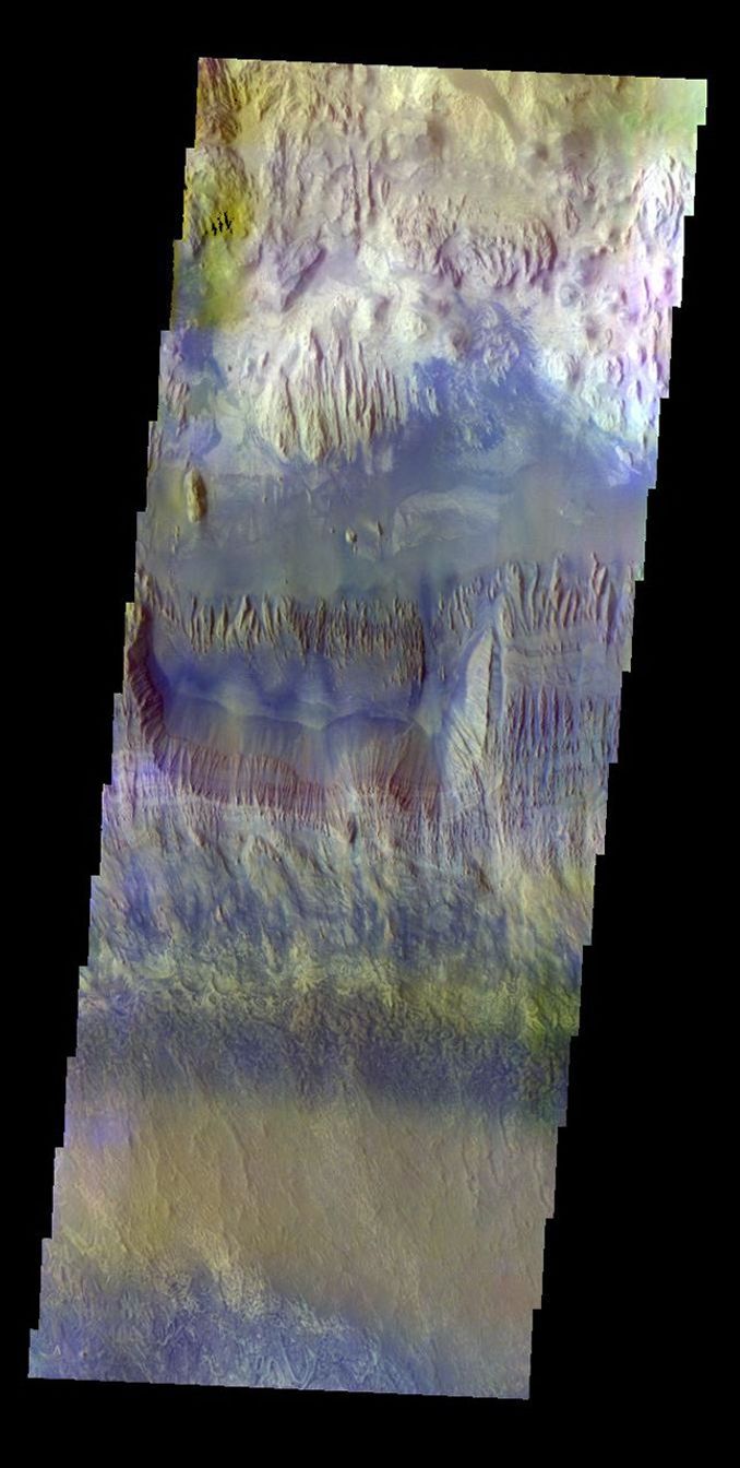 The THEMIS VIS camera contains 5 filters. The data from different filters can be combined in multiple ways to create a false color image. This false color image captured by NASA's 2001 Mars Odyssey spacecraft shows part of Hebes Chasma.