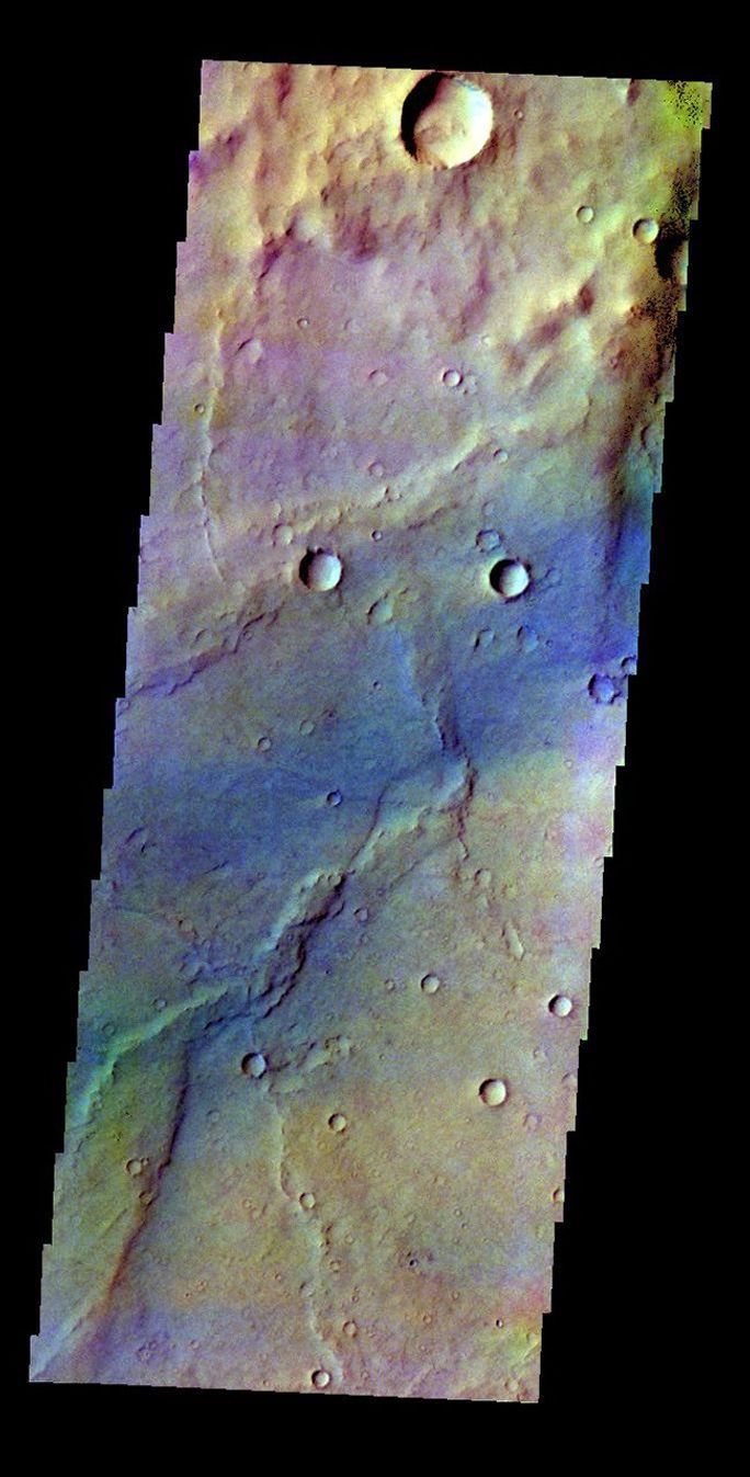 The THEMIS VIS camera contains 5 filters. The data from different filters can be combined in multiple ways to create a false color image. This false color image from NASA's 2001 Mars Odyssey spacecraft shows a region in Syrtis Major.