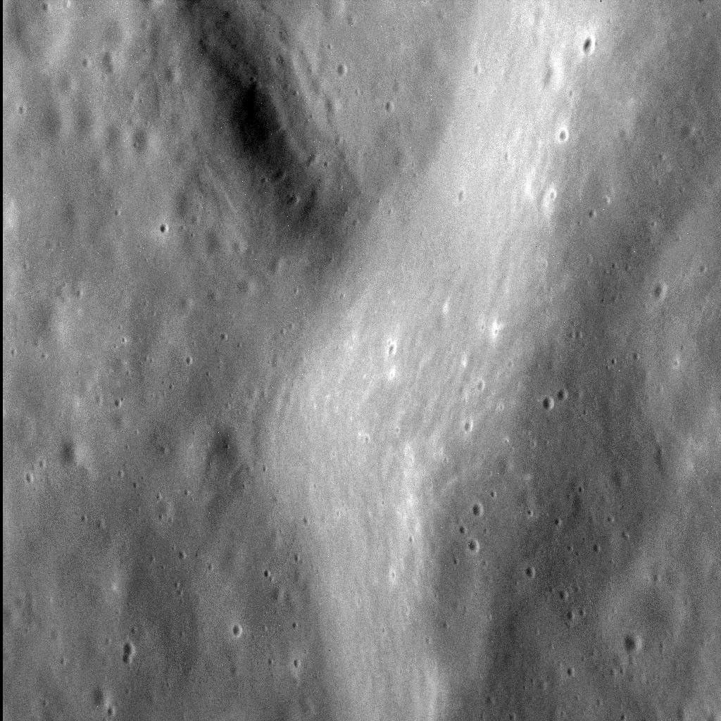 This image from NASA's MESSENGER spacecraft shows the fine texture on the inner wall of an unnamed impact basin 100 km (62 mi.) in diameter, situated immediately west of the larger Dali basin.