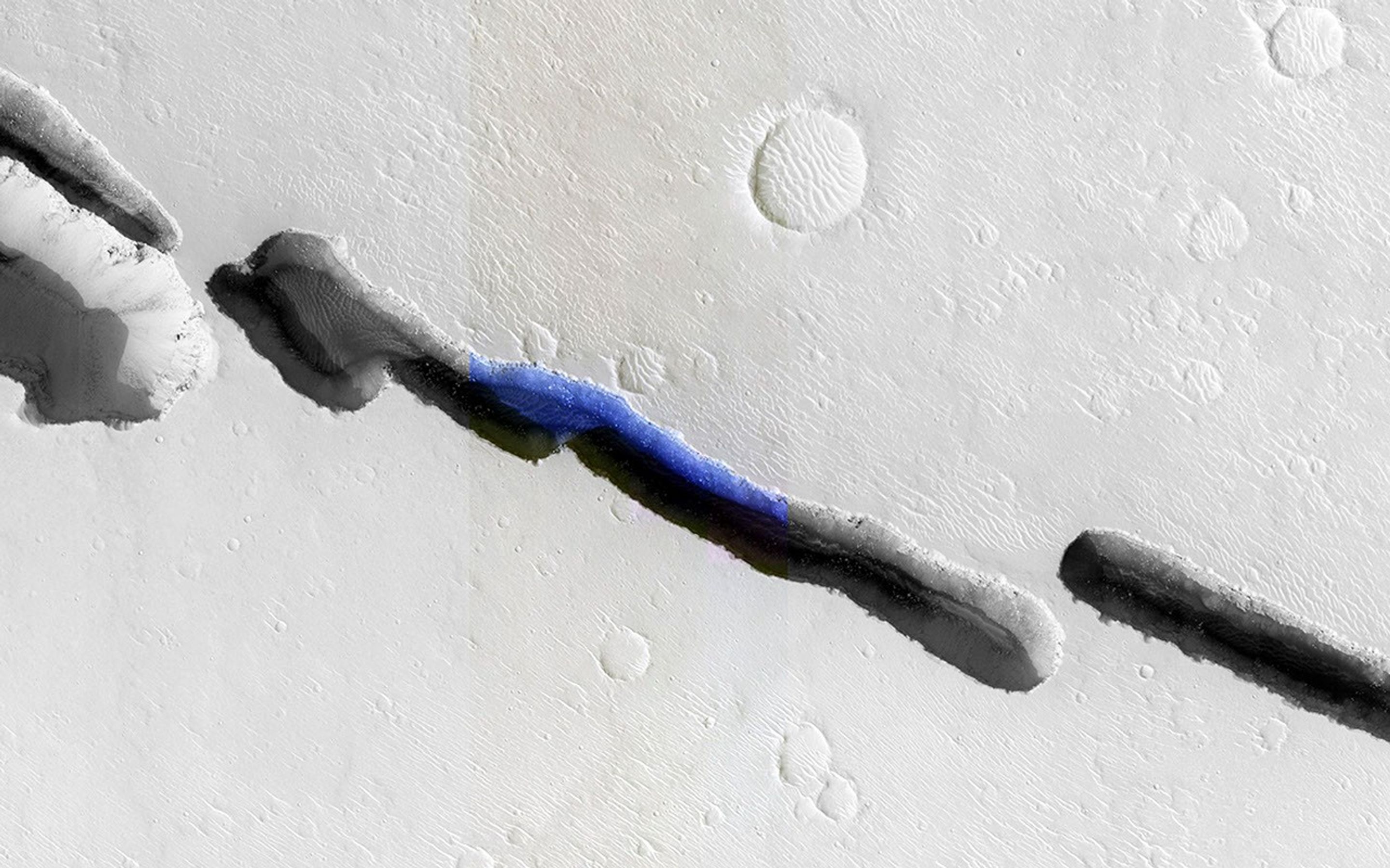 Visible in this observation from NASA's Mars Reconnaissance Orbiter is a section of Cerberus Fossae, which are comprised of a series of rifts present located in Elysium Planitia just north the Martian equator.
