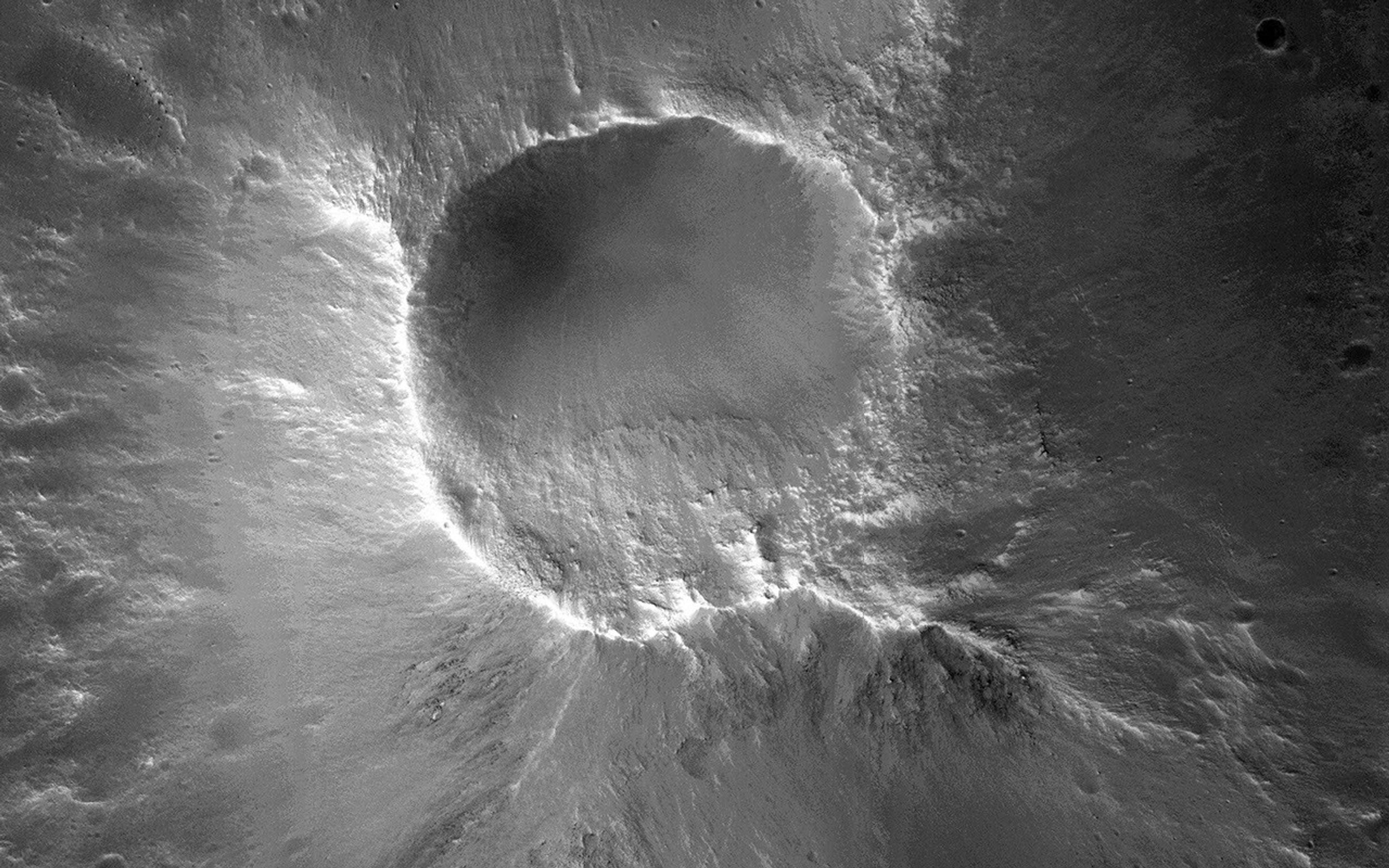 There are many knob formations is the southeastern Acidalia region of Mars. All show a hilltop crest except one which has a summit crater that resembles a cone volcano in this image captured by NASA's Mars Reconnaissance Orbiter.
