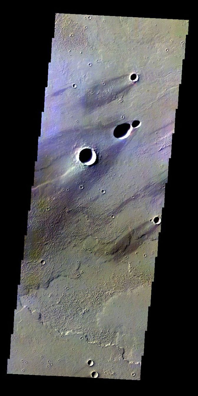 The THEMIS VIS camera contains 5 filters. The data from different filters can be combined in multiple ways to create a false color image. This false color image from NASA's 2001 Mars Odyssey spacecraft shows windstreaks in Daedalia Planum.