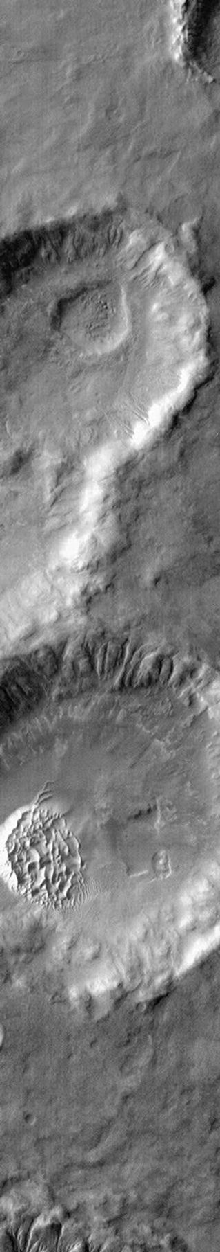 This image from NASA's 2001 Mars Odyssey spacecraft shows warm dunes are brighter than their surroundings in this infrared image of an unnamed crater in Noachis Terra.