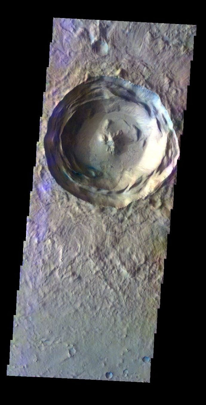 The THEMIS VIS camera contains 5 filters. The data from different filters can be combined in multiple ways to create a false color image. This false color image from NASA's 2001 Mars Odyssey spacecraft shows an unnamed crater in Isidis Planitia.
