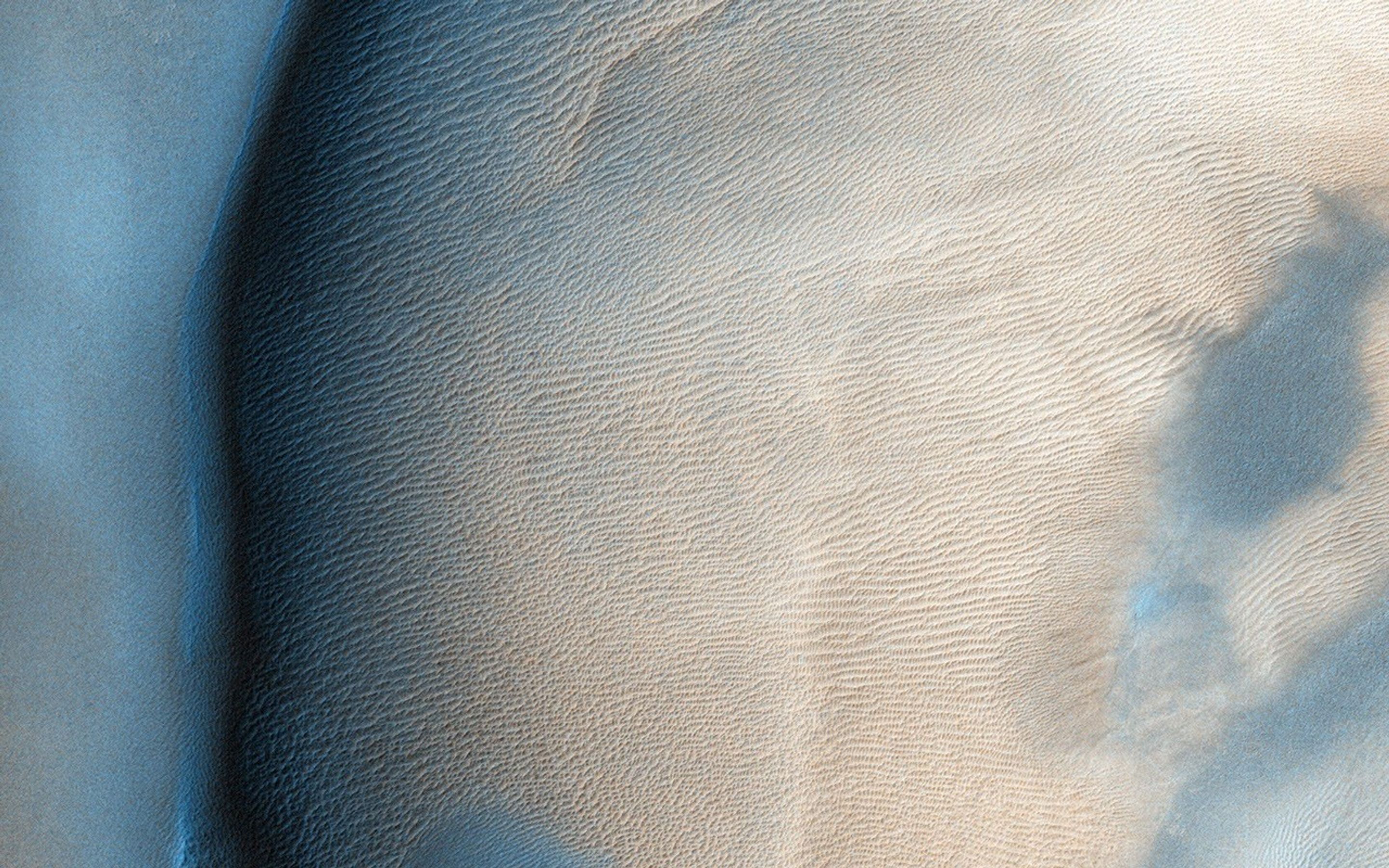 Taken in late southern spring and when Mars is near perihelion (closest distance to the Sun), this image from NASA's Mars Reconnaissance Orbiter shows the effects of dry ice sublimation on a longitudinal dune in the far Southern hemisphere.