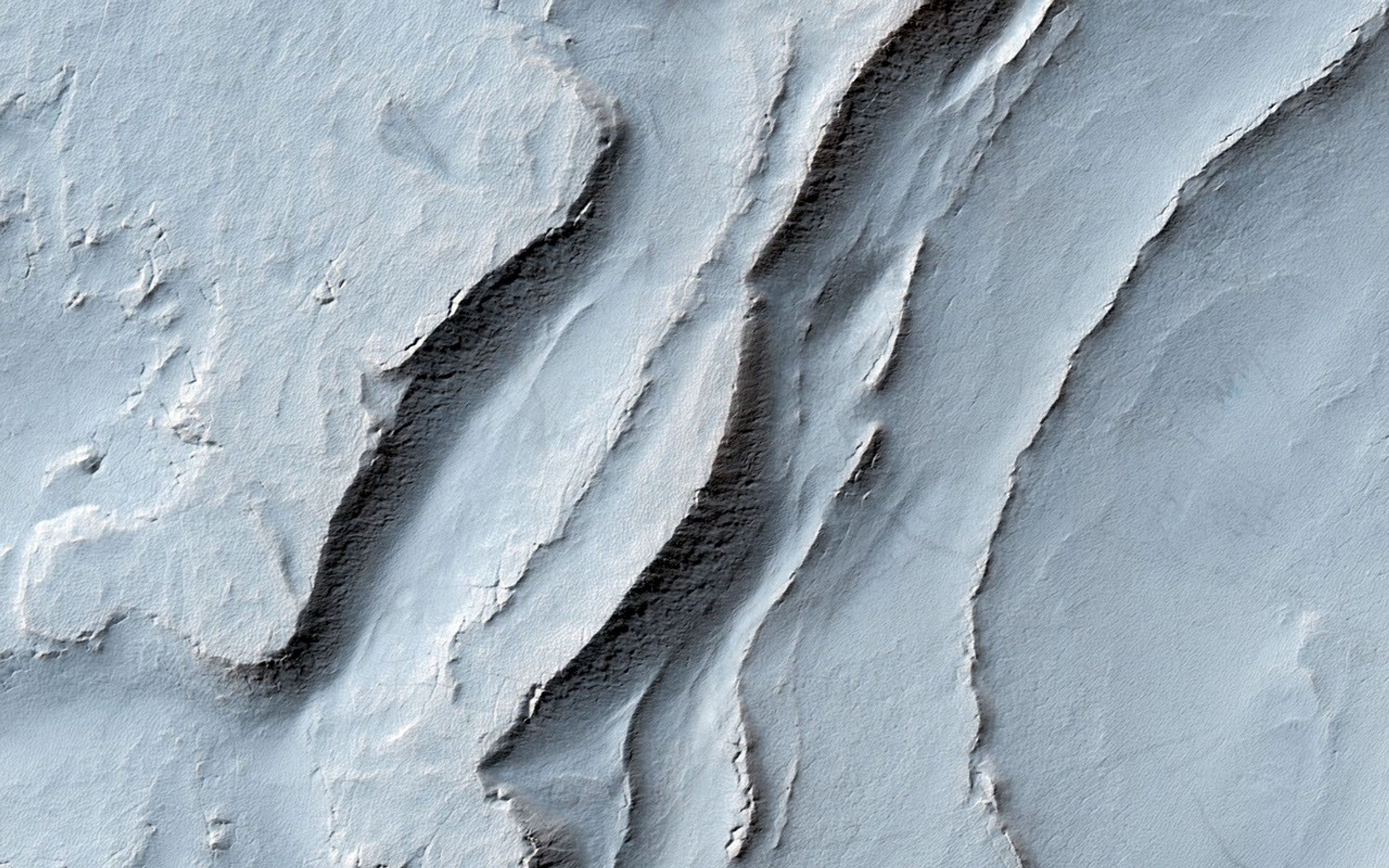 In this image from NASA's Mars Mars Reconnaissance Orbiter, we can see quite a spectacular layering pattern inside an impact crater called Spallanzani.