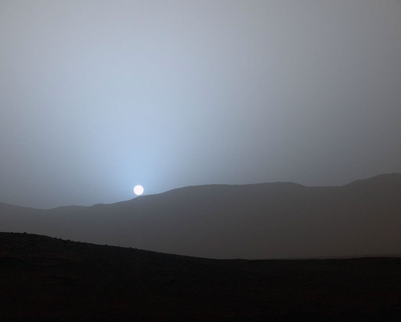 NASA's Curiosity Mars rover recorded this view of the sun setting at the close of the mission's 956th Martian day, or sol (April 15, 2015), from the rover's location in Gale Crater.