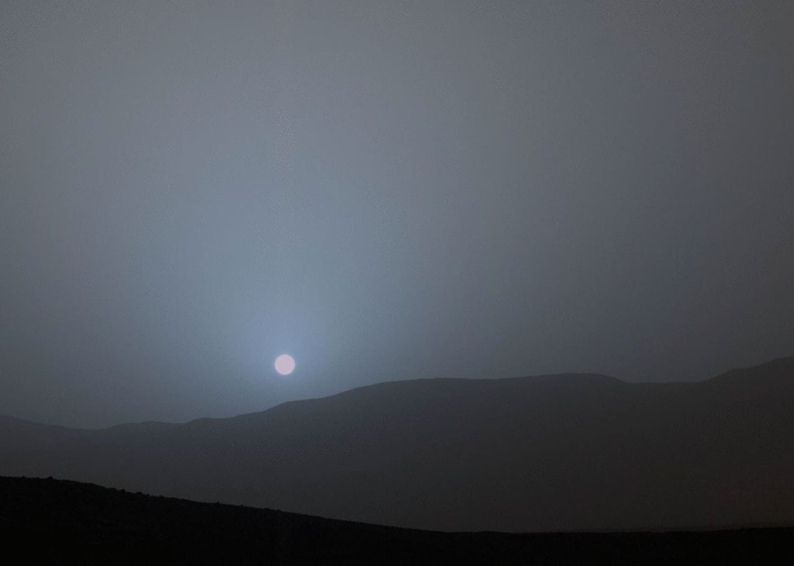 This frame is from sequence of views NASA's Curiosity Mars rover recorded of the sun setting at the close of the mission's 956th Martian day, or sol (April 15, 2015), from the rover's location in Gale Crater.
