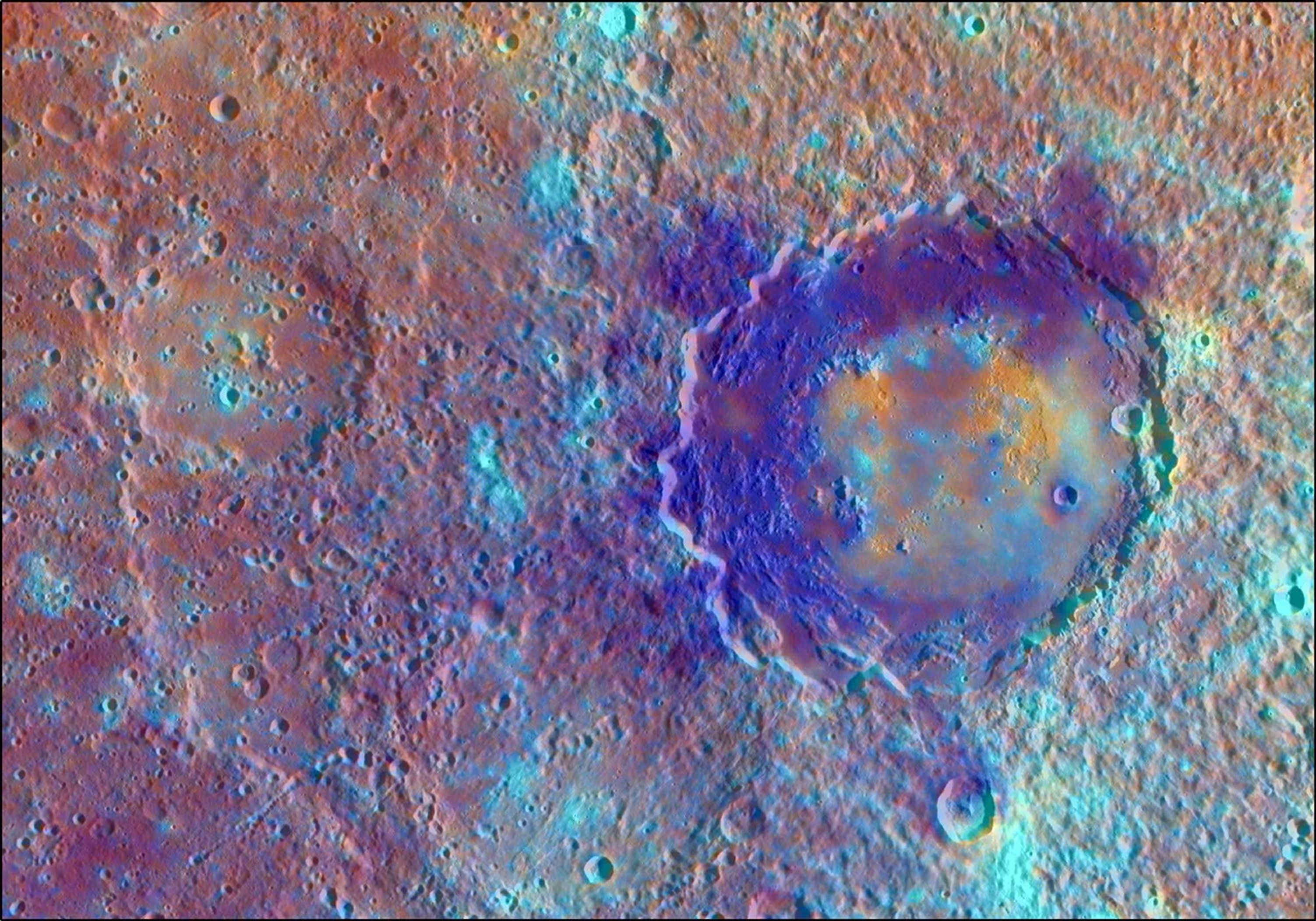 In this enhanced color view from NASA's MESSENGER spacecraft of the peak-ring basin Derain, the different colors accentuate the different rocks associated with the basin.