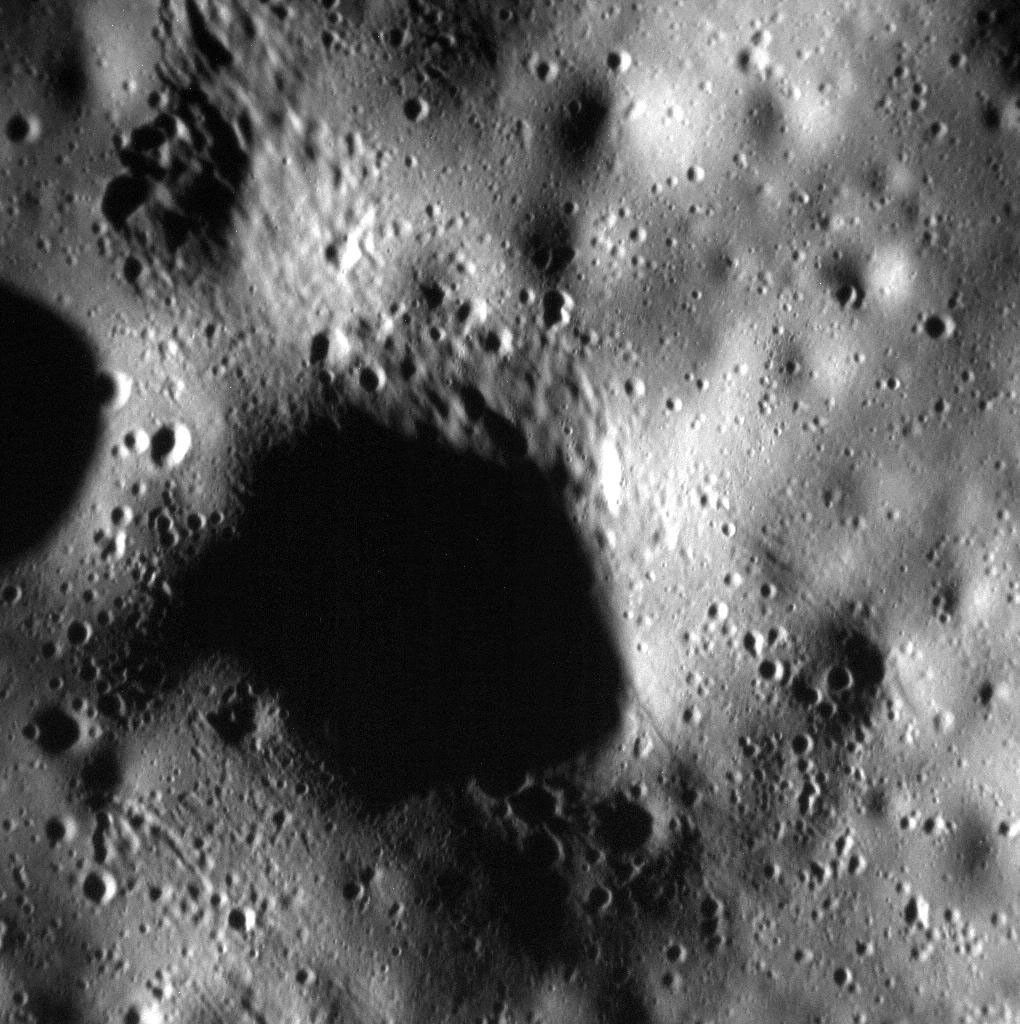 The surface in this scene captured by NASA's MESSENGER spacecraft has been pummeled by secondary craters, possibly from the impact that formed the nearby Mickiewicz crater.