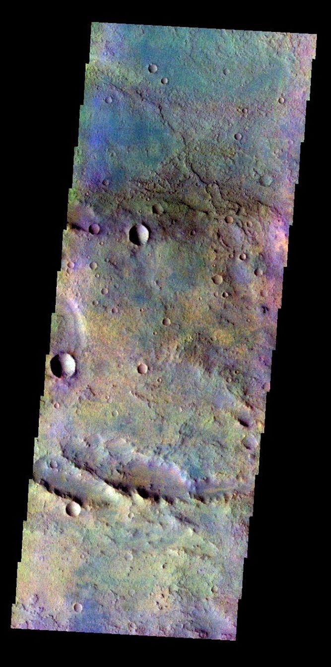 The THEMIS VIS camera contains 5 filters. The data from different filters can be combined in multiple ways to create a false color image. This false color image from NASA's 2001 Mars Odyssey spacecraft shows a portion of the plains in Terra Sabaea.