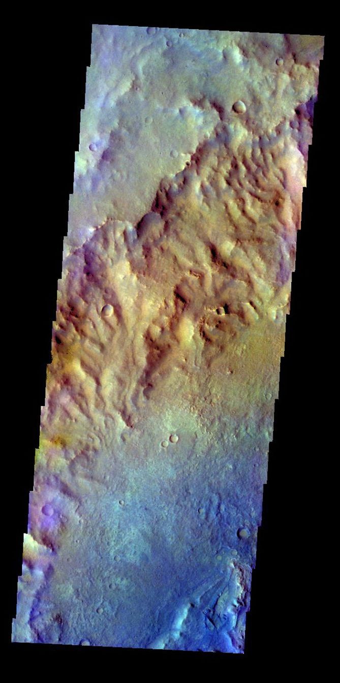 The THEMIS VIS camera contains 5 filters. Data from different filters can be combined in multiple ways to create a false color image. This image from NASA's 2001 Mars Odyssey spacecraft shows the inner rim and floor of an unnamed crater in terra Cimmeria.