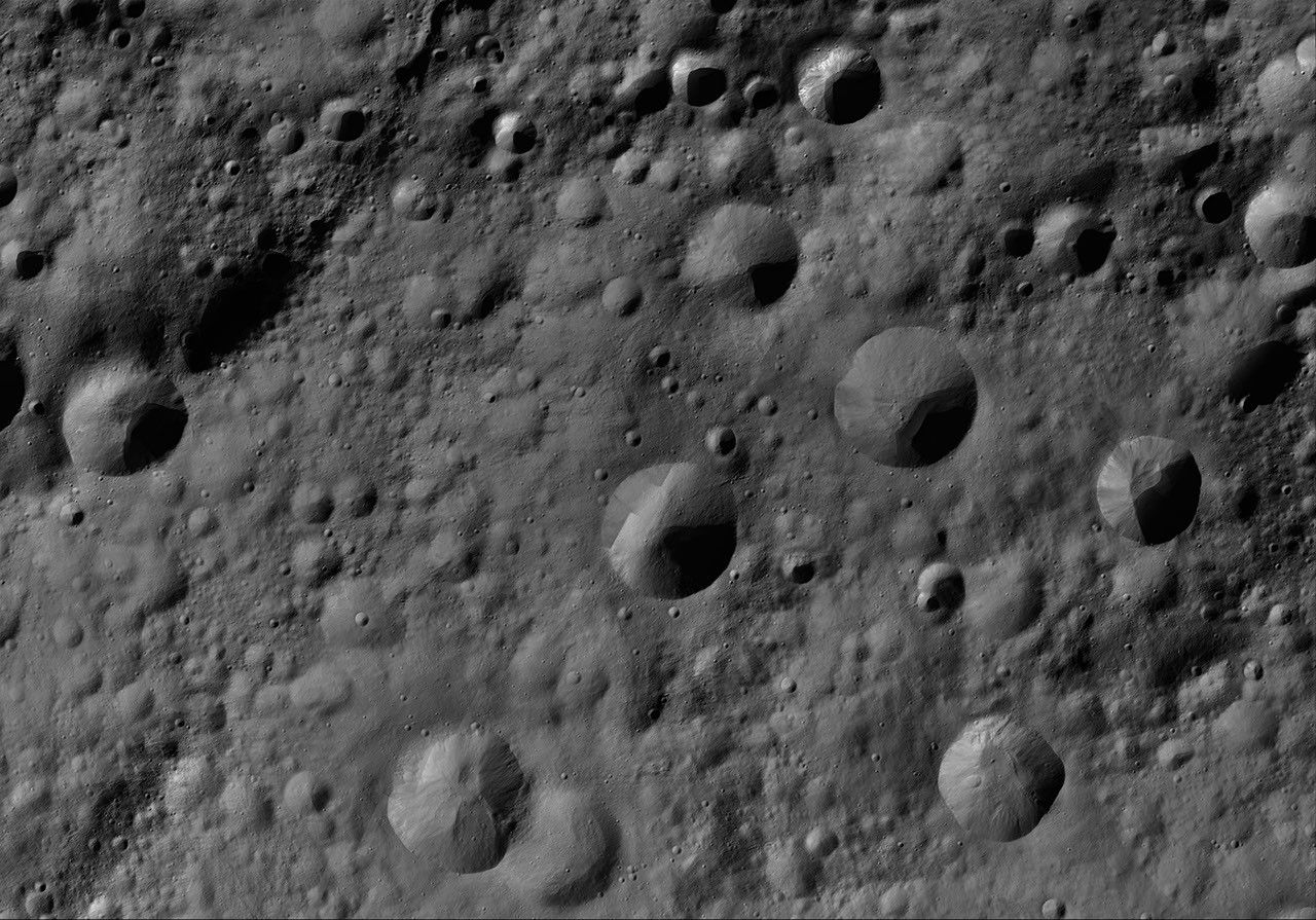 This image of Gegania AV-L-09, from the atlas of the giant asteroid Vesta, was created from images taken as NASA's Dawn mission flew around the object, also known as a protoplanet.