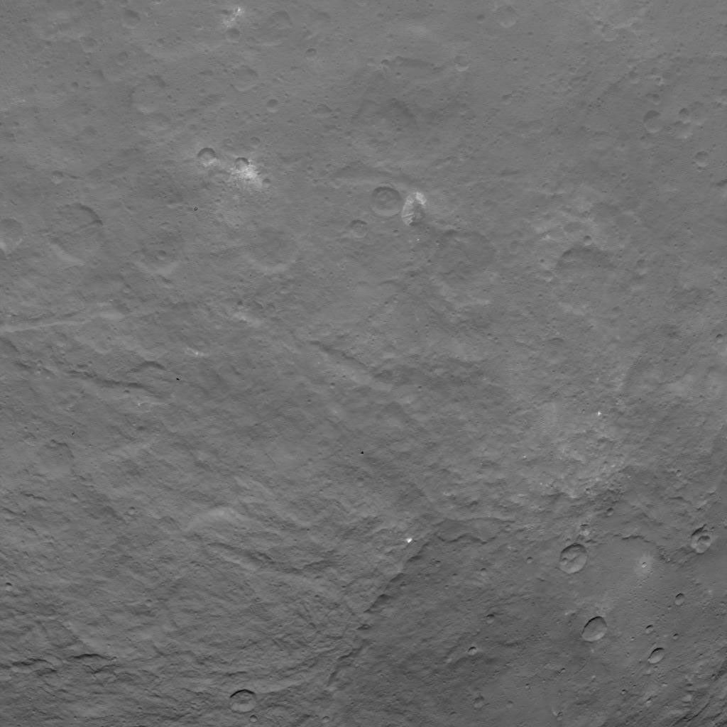 This image, taken on June 18, 2015 by NASA's Dawn spacecraft, shows dwarf planet Ceres from an altitude of 2,700 miles (4,400 kilometers) -- a mountain 3 miles (5 kilometers) high, surrounded by relatively smooth terrain, can be seen here.