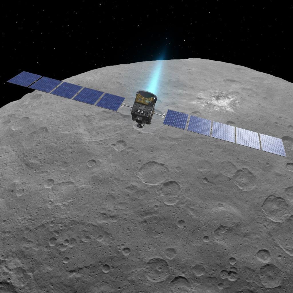 This artist concept shows NASA's Dawn spacecraft above dwarf planet Ceres, as seen in images from the mission.