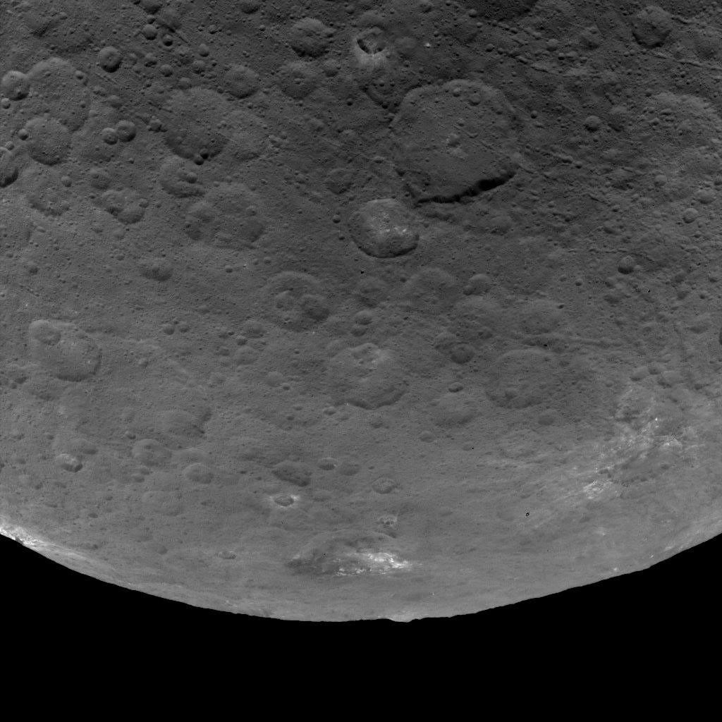 This image of Ceres, taken by NASA's Dawn spacecraft, features several craters with bright material within and around them. The image is centered on terrain near the equator of Ceres and faces southeast.