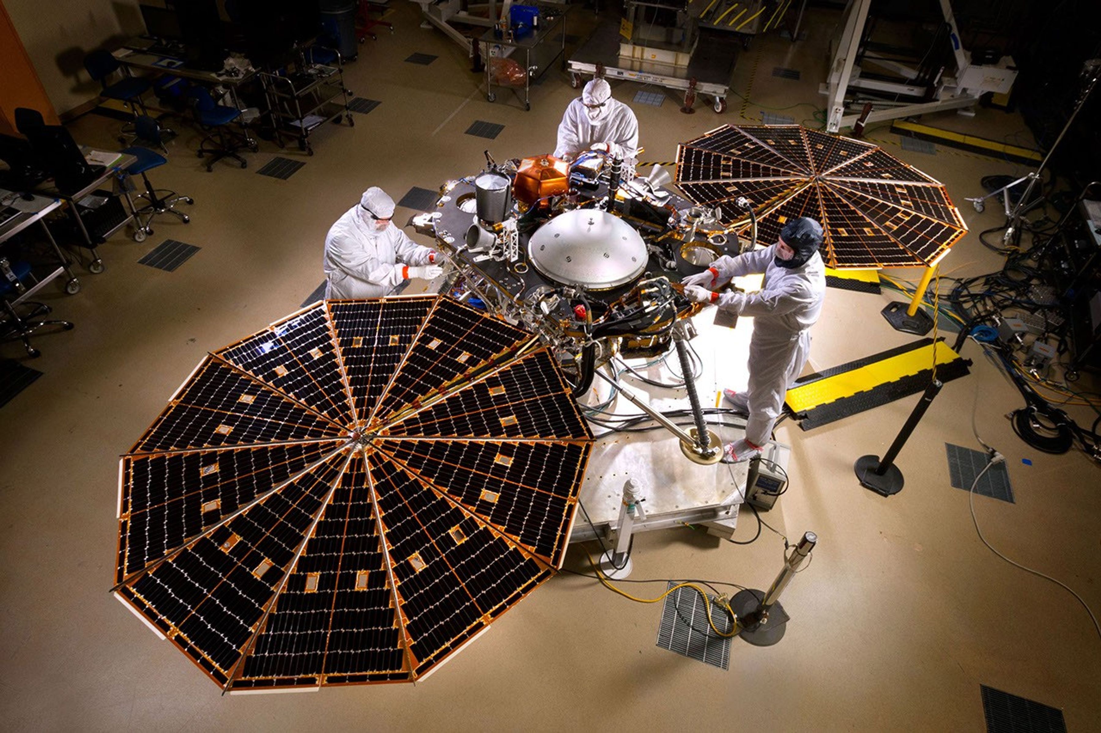The solar arrays on NASA's InSight lander are deployed in this test inside a clean room at Lockheed Martin Space Systems, Denver. This configuration is how the spacecraft will look on the surface of Mars. The image was taken on April 30, 2015.