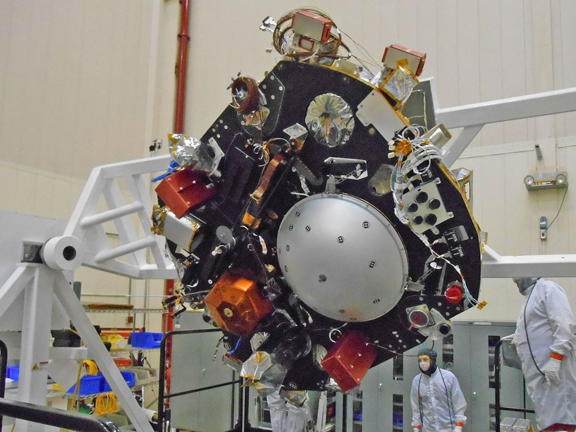 The science deck of NASA's InSight lander is being turned over in this April 29, 2015, photo from InSight assembly and testing operations inside a clean room at Lockheed Martin Space Systems, Denver.