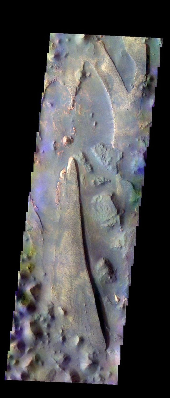 The THEMIS VIS camera contains 5 filters. The data from different filters can be combined in multiple many ways to create a false color image. This image from NASA's 2001 Mars Odyssey spacecraft shows part of Aureum Chaos.