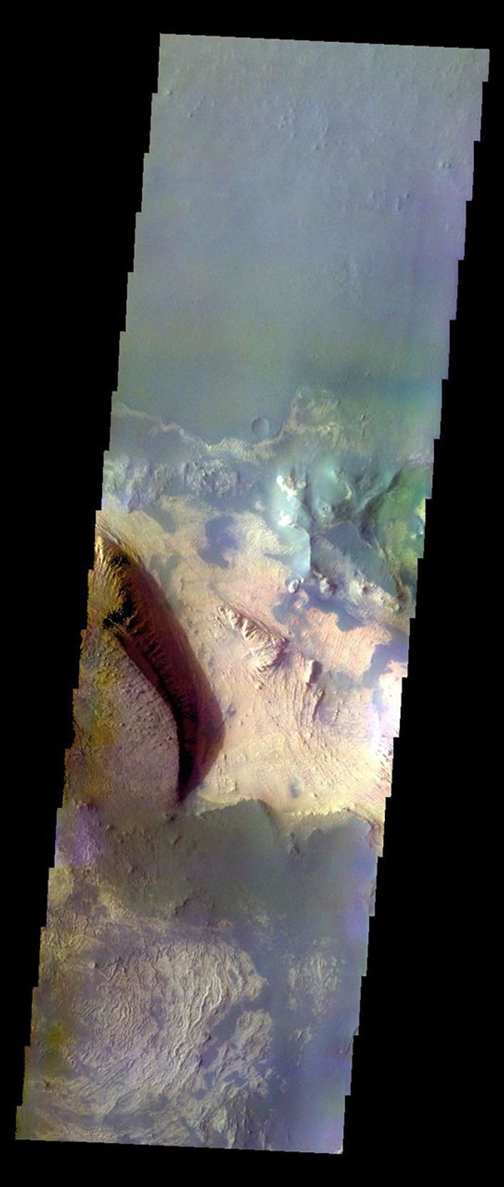 The THEMIS VIS camera contains 5 filters. The data from different filters can be combined in multiple many ways to create a false color image. This false color image from NASA's 2001 Mars Odyssey spacecraft shows part of Melas Chasma.