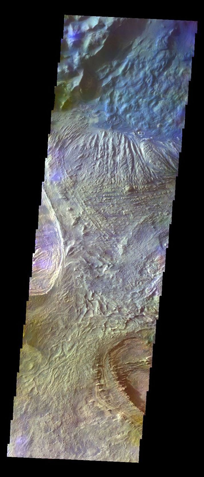 The THEMIS VIS camera contains 5 filters. The data from different filters can be combined in multiple ways to create a false color image. This image from NASA's 2001 Mars Odyssey spacecraft shows part of the floor of Candor Chasma.