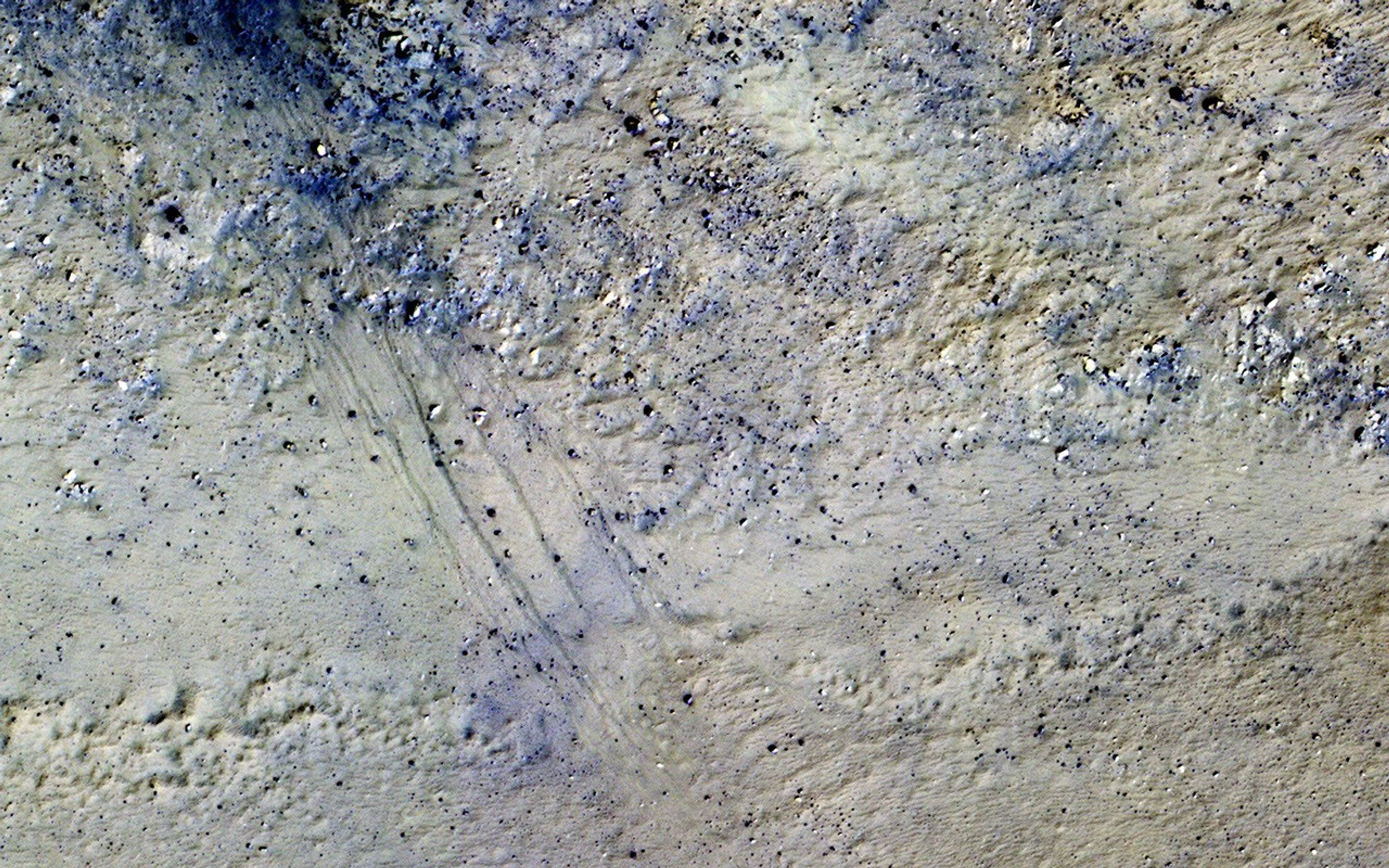 This image from NASA's Mars Reconnaissance Orbiter shows the central peak in Porter Crater. Southward on the slopes below the peak is a large dune field.