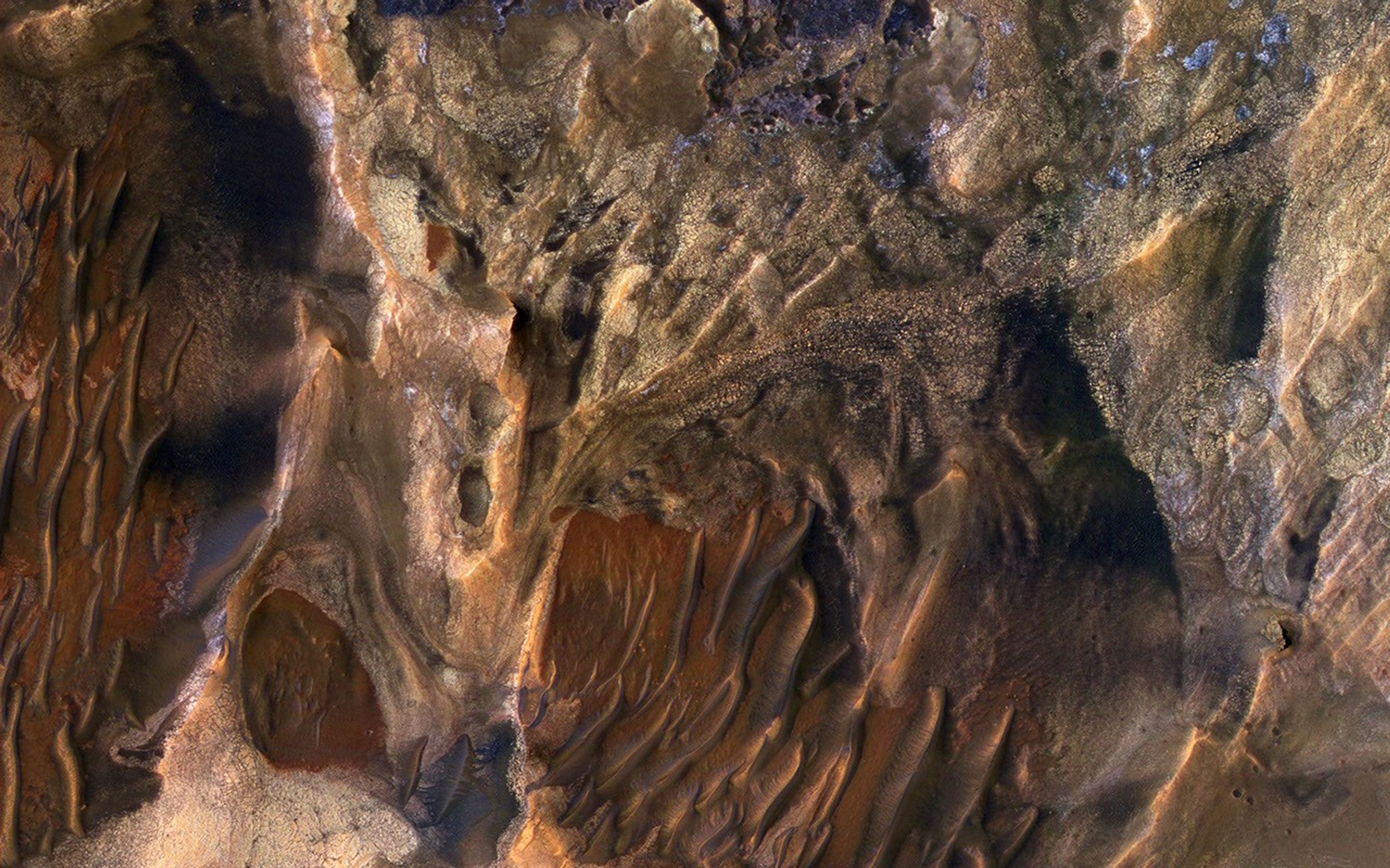 This scene captured by NASA's Mars Reconnaissance Orbiter includes chaotic deposits with a wide range of colors. The deposits are distinctive with both unique colors and small-scale textures such as fracture patterns.