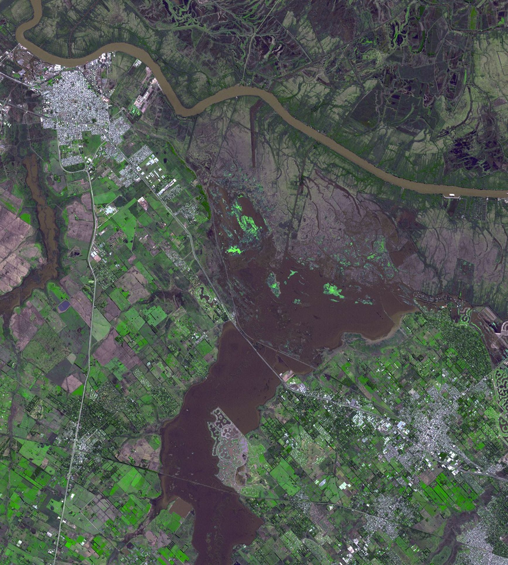 Northwest of Buenos Aires, Argentina, seven straight days of torrential rains of up to 16 inches (40 centimeters) in August 2015 resulted in flooding between the cities of Escobar and Campana as seen by NASA's Terra spacecraft.