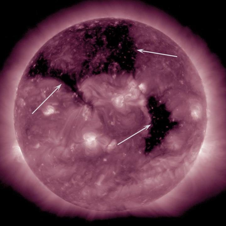Three substantial coronal holes rotated across the face of the Sun the week of Sept. 8-10, 2015 as seen by NASA's Solar Dynamics Observatory. Coronal holes are areas where the Sun's magnetic field is open and a source of streaming solar wind.
