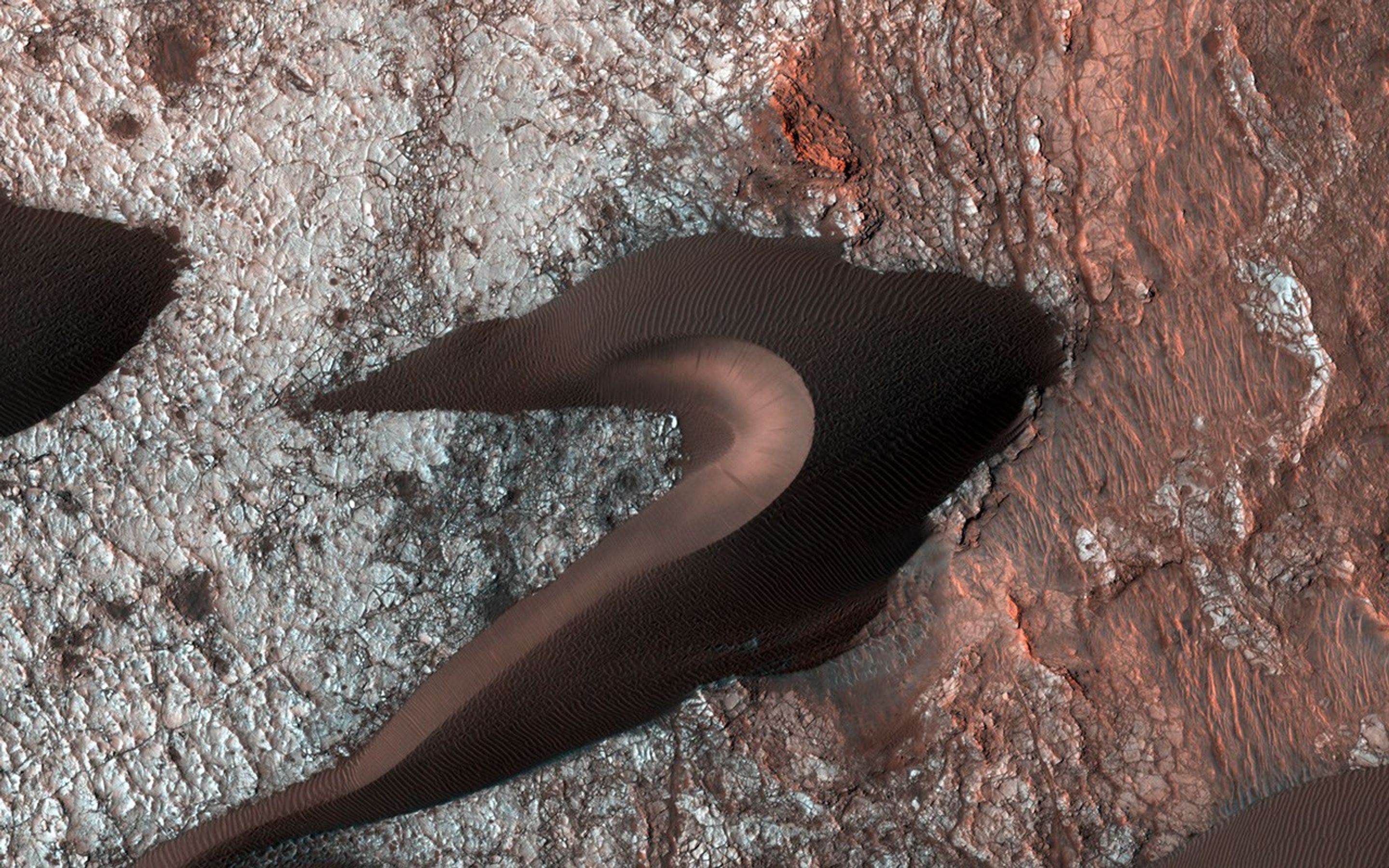 This image from NASA's Mars Reconnaissance Orbiter spacecraft provides information about erosion and movement of surface material, about wind and weather patterns, even about the soil grains and grain sizes.