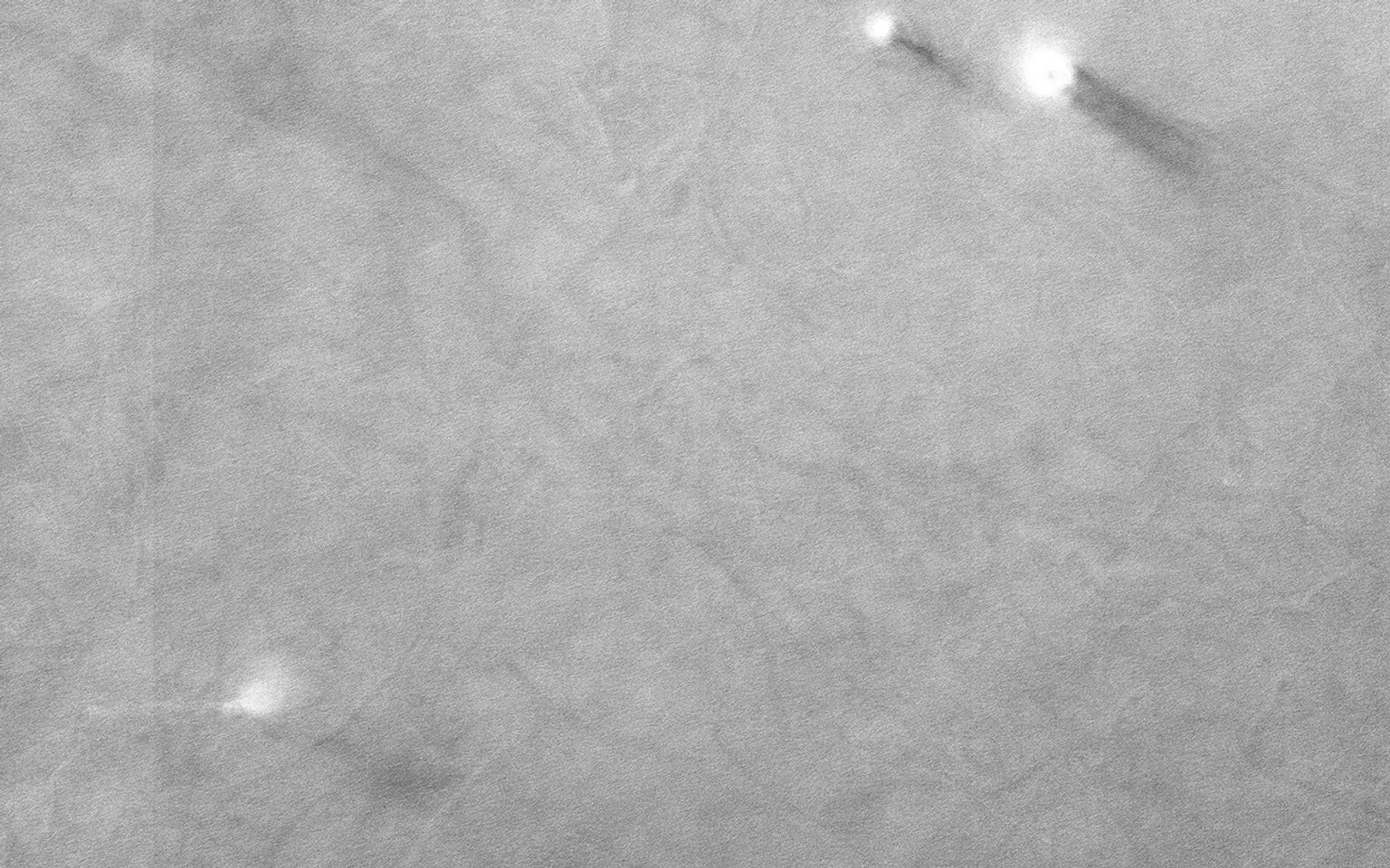 On an early fall afternoon in Ganges Chasma (Valles Marineris), NASA's Mars Reconnaissance Orbiter spacecraft managed to capture a cluster of eight dust devils.