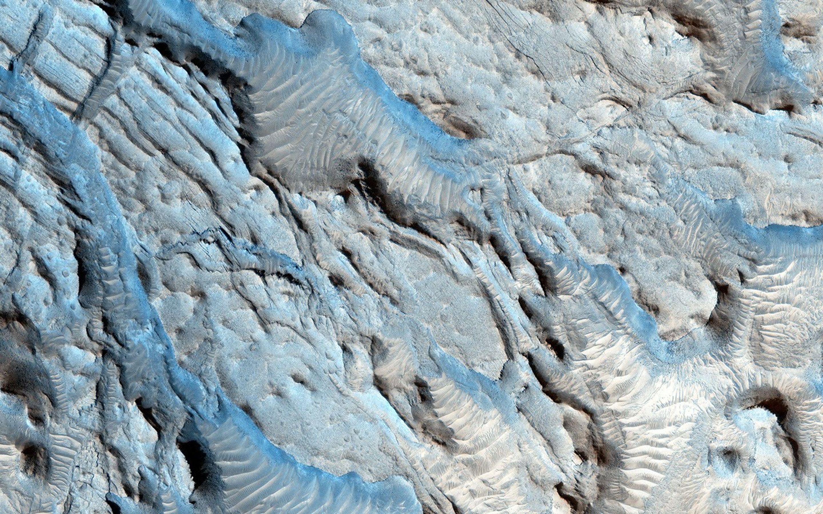 The southern section of Cydonia Region is dominated by both a series of craters and the remnants of channels that may be from a past fluvial system as seen by NASA's Mars Reconnaissance Orbiter spacecraft.