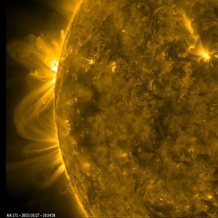 As a pair of active regions began to rotate into view, their towering magnetic field lines above them bloomed into a dazzling display of twisting arches (Oct. 27-28, 2015) in this image from NASA's Solar Dynamics Observatory.