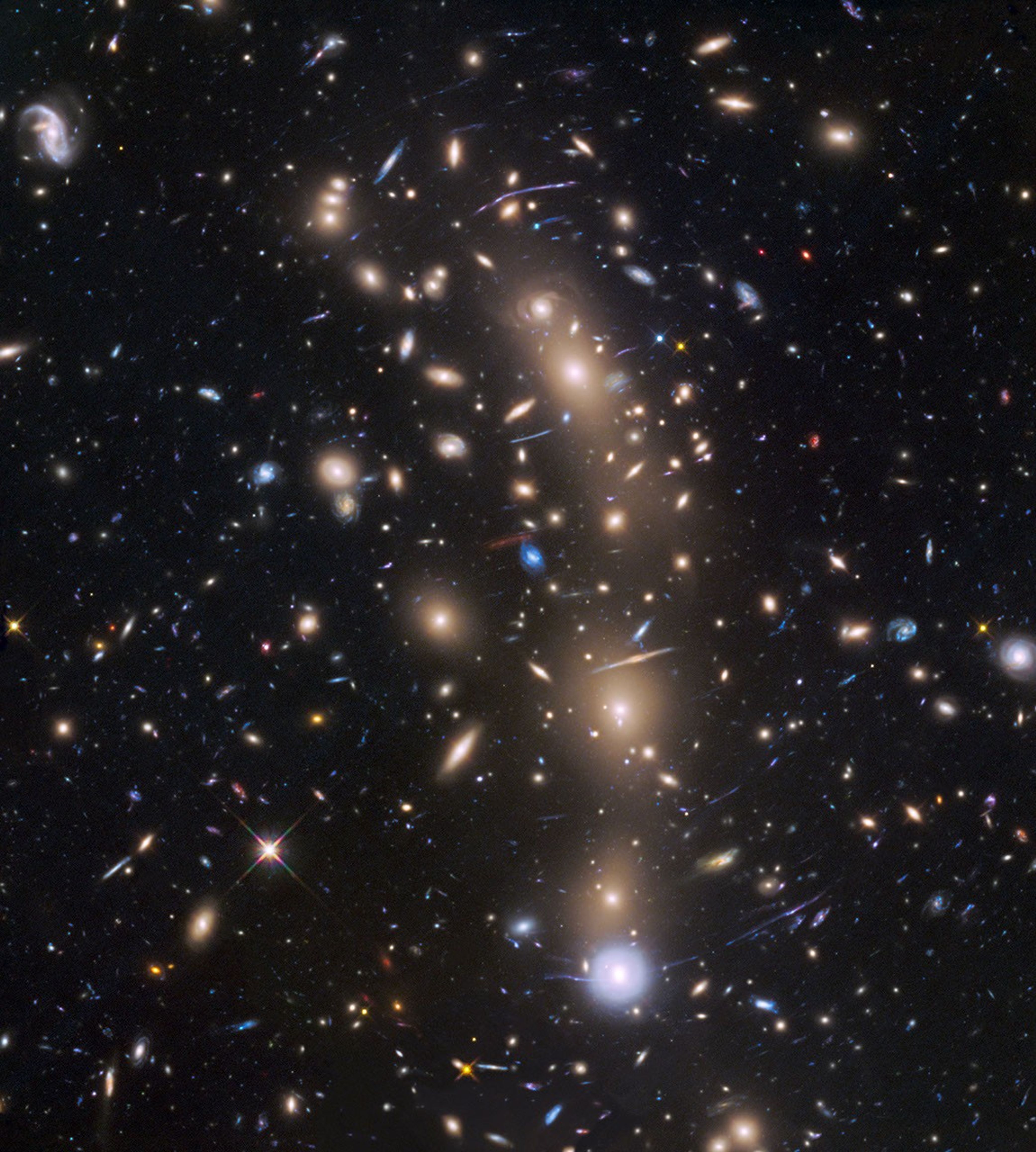 This is view from ESA's Hubble Space Telescope of a very massive cluster of galaxies, MACS J0416.1-2403, located roughly 4 billion light-years away and weighing as much as a million billion suns.