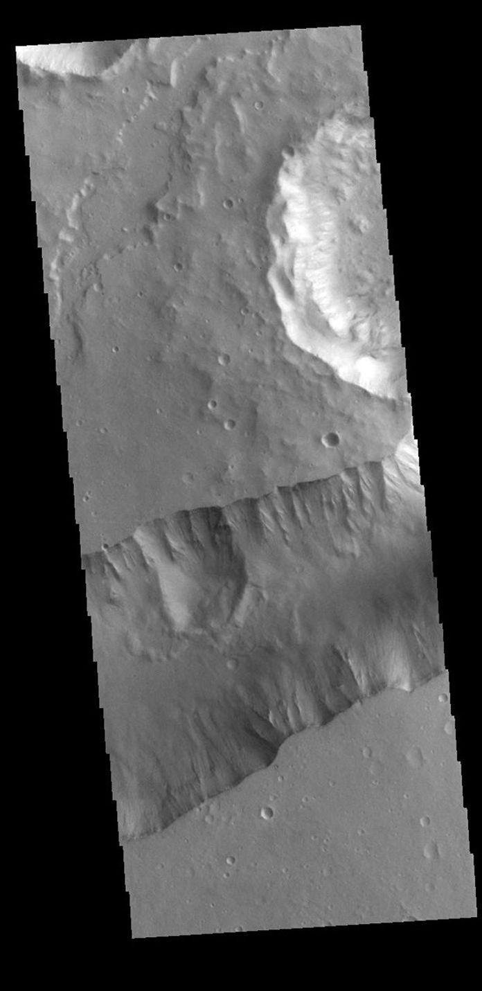 The steep sided depression in this image captured by NASA's 2001 Mars Odyssey spacecraft is Shalbatana Vallis, a channel located in Xanthe Terra.