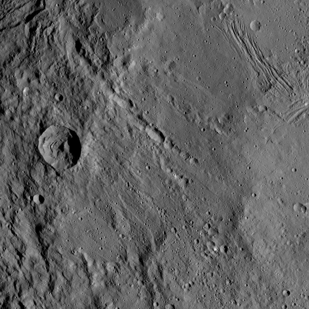 This view from NASA's Dawn spacecraft shows different types of terrain located side by side on Ceres: a smooth terrain at right with numerous small impact craters, and a less-cratered, hummocky terrain at left.