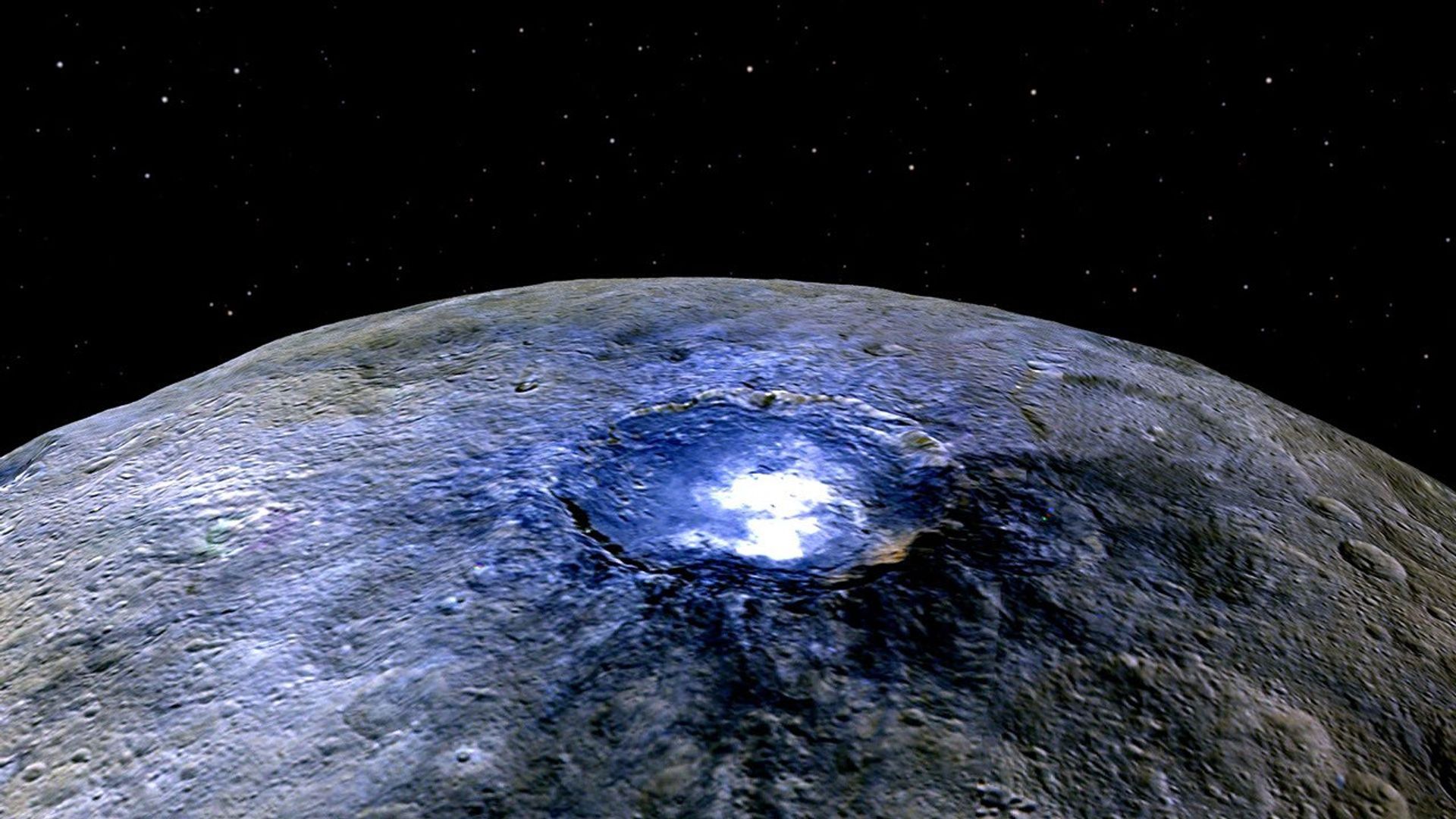 This false color image from NASA's Dawn spacecraft of Ceres' Occator Crater shows differences in surface composition. The color blue is generally associated with bright material seems to be consistent with salts, such as sulfates.