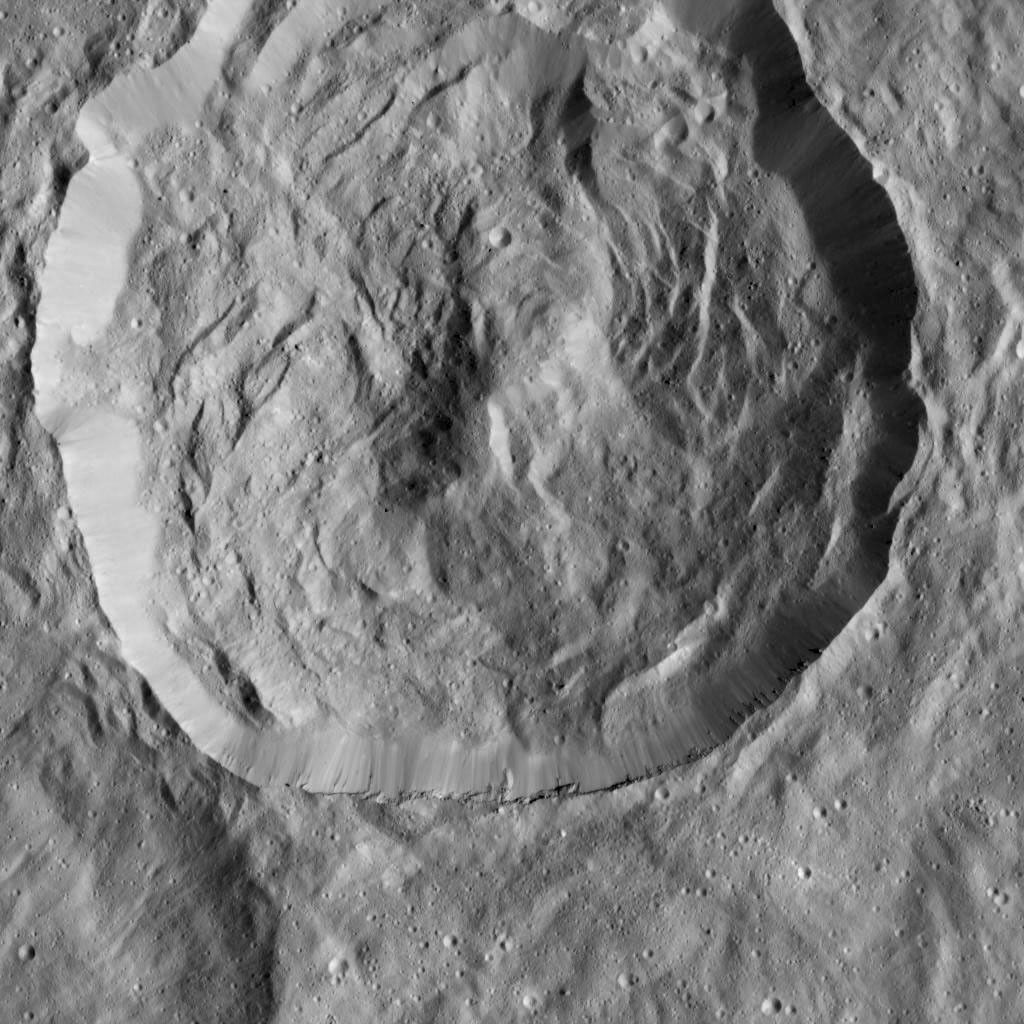 This Cerean crater, which is covered in ridges and steep slopes, called scarps, was captured by NASA's Dawn spacecraft on Dec. 23, 2015. These features likely resulted when the crater partly collapsed during its formation.