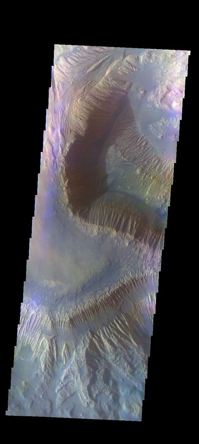The THEMIS VIS camera contains 5 filters. The data from different filters can be combined in multiple ways to create a false color image. This image captured by NASA's 2001 Mars Odyssey spacecraft shows part of Hebes Mensa.