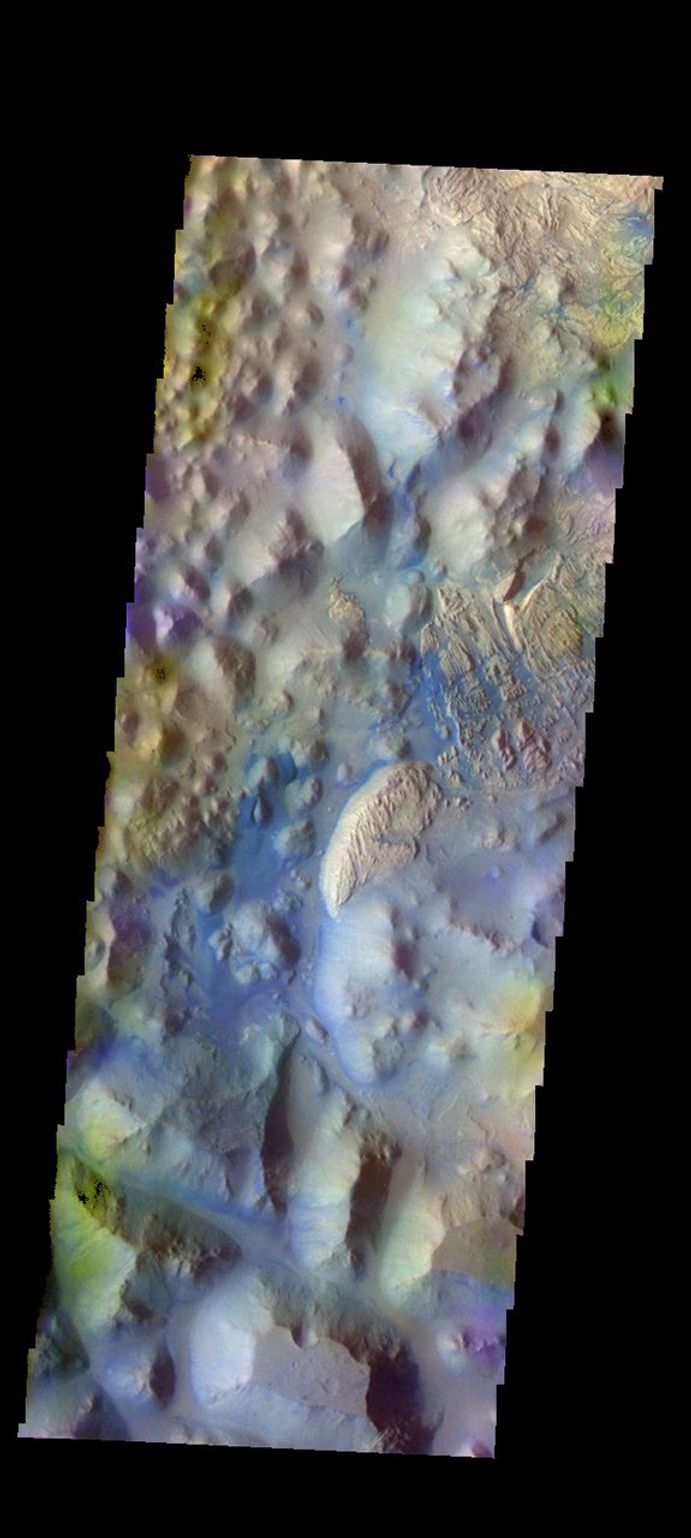 The THEMIS camera contains 5 filters. The data from different filters can be combined in multiple ways to create a false color image. This image captured by NASA's 2001 Mars Odyssey spacecraft shows part of Iani Chaos.