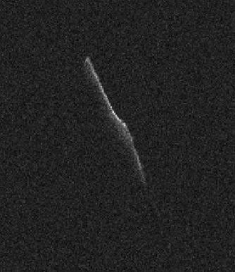 The elongated asteroid in this radar image, named 2003 SD220, will safely fly past Earth on Dec. 24, 2015, at a distance of 6.8 million miles (11 million kilometers).