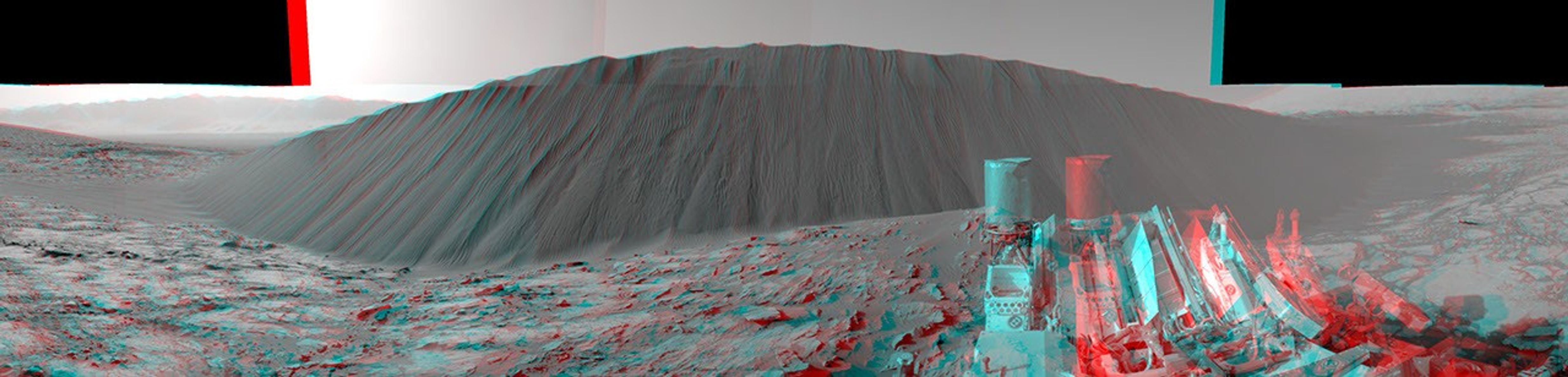This stereo view from NASA's Curiosity Mars Rover, taken on Dec. 17, 2015, shows the downwind side of a dune about 13 feet high within the Bagnold Dunes on Mars. You need 3-D glasses to view this image.
